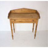 A Victorian pine washstand, with single drawer, raised on turned legs, length 84cm, height 90cm.