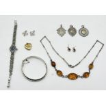 A collection of 925 silver jewellery, bangle, medallions, amber necklace, cocktail watch along