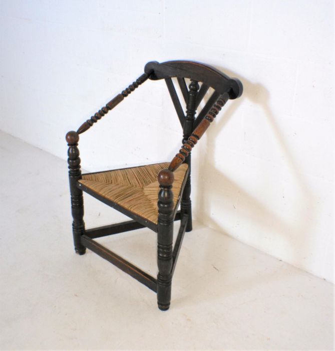 A Liberty style oak corner chair with rush seat. - Image 2 of 5