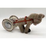 A vintage Pedigree push along toy horse pulling a tin plate cart. The cart comprising of two