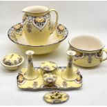 A decorative jug and bowl set (hairline crack in jug) with assorted matching pieces