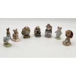 A collection of seven Royal Albert Beatrix Potter figures including "And This Pig had None", Tom