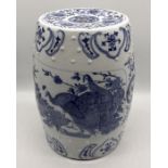 A Chinese pottery stool with blue and white bird detail - height 47cm
