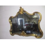 A carved gilt framed overmantle mirror with rococo style detailing, approx. 82cm width