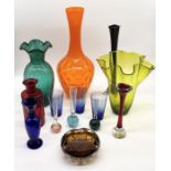 A collection of various art glass including large orange vase, flower vases etc.