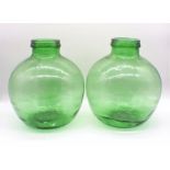 Two green glass carbuoys, both marked 'Viresa' to top, approximately 36cm tall.