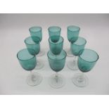 A set of nine Victorian green glasses