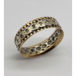 An unmarked 9ct gold and silver eternity ring, weight 3.4g