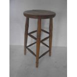 A vintage beech bar stool