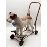 A vintage Tri-Ang push along/ride-on Airdale Terrier toy