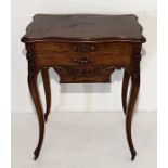 A 19th century French sewing table with three drawers and birdseye walnut interior on cabriole