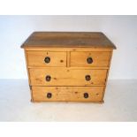 A small pine chest of four drawers, no feet, length 86cm, height 69cm.