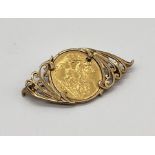 A 1913 half sovereign mounted as a 9ct gold brooch, total weight 7.4g