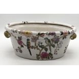 A vintage Chinese style ceramic footbath with sculpted handles and parrot motif - 44cm x 30cm x