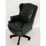 A modern leather button back office chair