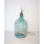 An antique glass carboy with light fitting, approximate height 65cm.