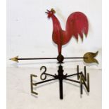 A painted wrought iron weathervane having 'N', 'S', 'E' and 'W' pointers and a cockerel arrow - 90cm