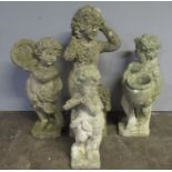 Four weathered "Cherub" garden statues. Height of tallest figure 88cm
