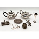 A collection of silver plated items including double ended drinks measure, two tea pots, silver