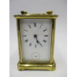 A turn of the century brass carriage clock with alarm
