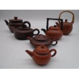 Six miniature Chinese terracotta teapots all but one with character marks to base