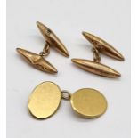 A single 18ct gold cufflink (weight 5.4g) along with a pair of 9ct gold cufflinks (weight 3.6g)