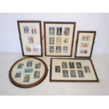 A quantity of framed vintage postcards.