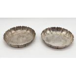 A pair of hallmarked silver dishes with pie crust edge, total weight 134.4g