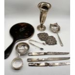 A collection of hallmarked silver items including tortoiseshell and silver hand mirror, tea