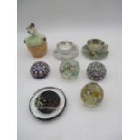 A collection of five paperweights, along with a novelty jam pot and two German cups and saucers