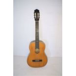 A 'Musima' classical 6 string guitar.