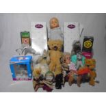 A collection of various soft toys, baby dolls and boxed figurines, along with two certificated boxed