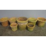 A collection of basket weave terracotta pots.