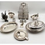 A collection of silver plated items including a four decanter holder (two bottles A/F) fighting