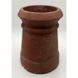 A small terracotta chimney pot