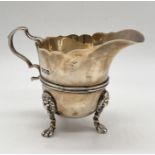A hallmarked silver cream jug, London 1904, weight 111.5g