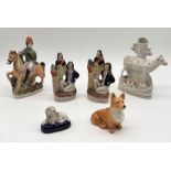 A collection of Staffordshire pottery including spill vase in the form of a cow, seated Poodle etc