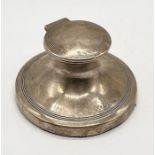 A hallmarked silver capstan inkwell