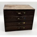 A small oak chest of four drawers