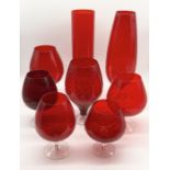 A collection of ruby art glass vases, oversized glasses etc.