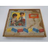 A wooden boxed Lego System set containing a quantity of vintage Lego