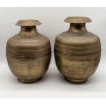 A near pair of Eastern bronze water pots - height 40cm