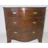 A serpentine fronted chest of three drawers. 83cm x 52cm, height 82cm