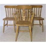 A pair of beech carvers along with two similar chairs.