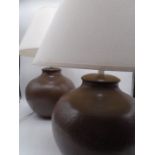 A pair of large pottery table lamps