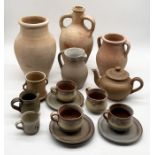 A collection of terracotta vases and studio pottery including teapot and four cups and saucers