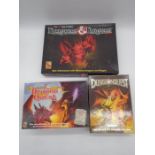 A collection of three boxed fantasy board games including Games Workshop Dungeon Quest, TSR Dungeons