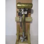 A vintage Seagull short shaft outboard motor with brass fittings