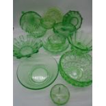 A collection of Uranium and green glass bowls and dishes