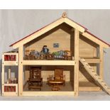 A Pintoy wooden dolls house, along with a small selection of furniture